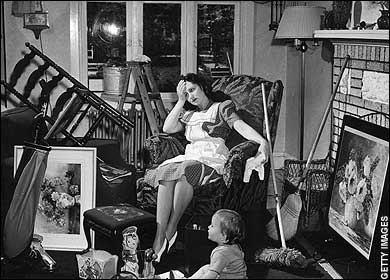 Photo of woman surrounded by clutter and looking overwhelmed.