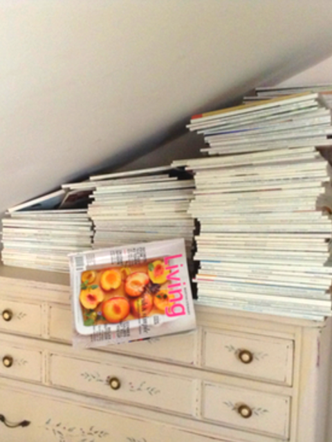Martha Stewart Magazines stacked on a dresser. This creates a lot of clutter.