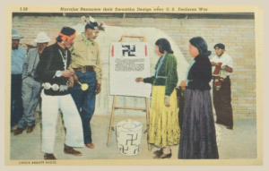 Postcard showing indigenous people from various southwest tribes signing a declaration that they would not use the swastika symbol on their artwork after February 28, 1940.